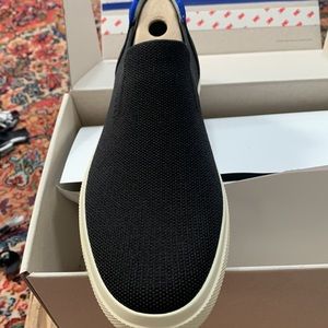 Brand new Rothy’s City slip on sneaker in black.